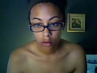 Ebony girl in glasses exposes her body for the webcam
