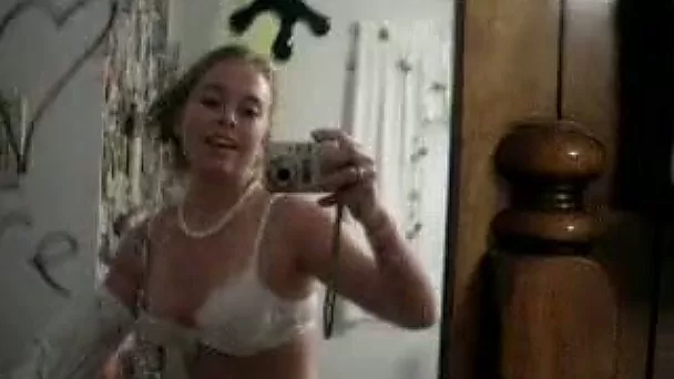 Solo scene with a nasty teen stripping in front of a mirror