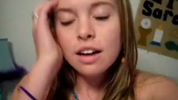 Brown-haired teen entertains herself by tickling her snatch