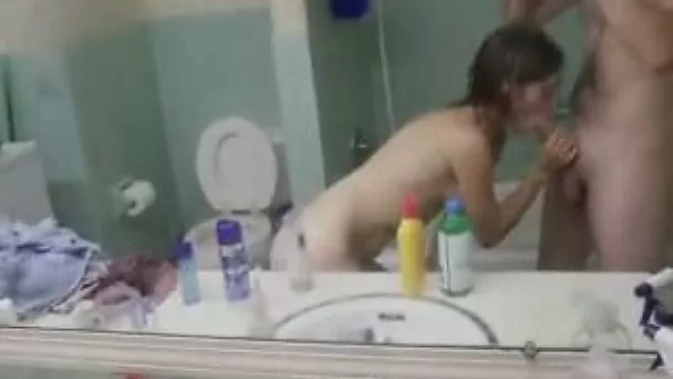 Horny teen sucks a dick in the bathroom and gets fucked from behind