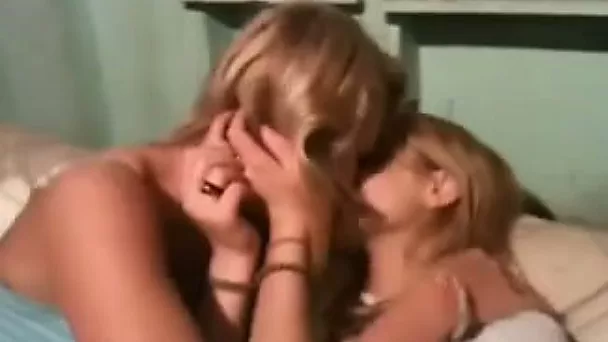 Three playful lesbians kiss and tease each other passionately