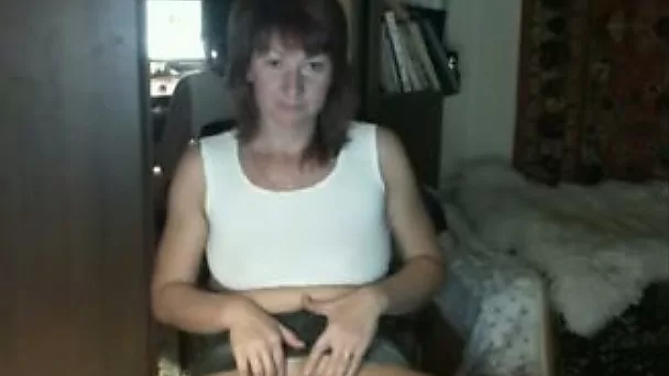 Red-haired Russian nympho in denim shorts loves masturbating on cam