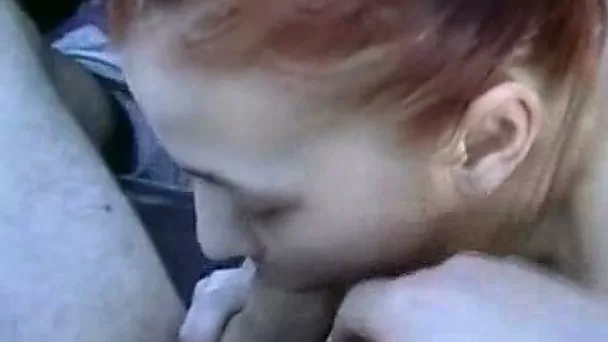 Dirty redhead hooker gives me a quick blowjob in car