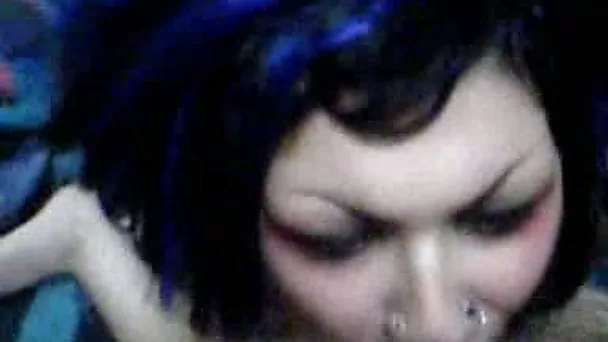 Freaky emo brunette with pierved lips happily sucking dick