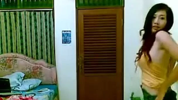 Asian lascivious brunette milf slut undresses on webcam