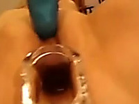 Horny chick gets a speculum in her tight twat and demonstrates all she got