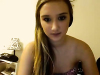 Blonde teenage sweetie talks on cam and takes all her clothes off