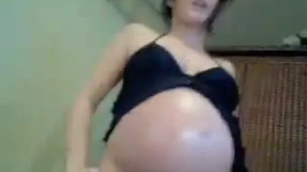 Pregnant brunette cutie fingers her pussy in webcam solo video