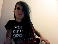 Skinny emo chick shows her tattooed booty for the webcam