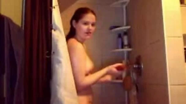 Webcam solo video with my lover taking a shower and rubbing her tits