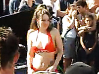 Beautiful sluts on the car show going topless in front of the crowd
