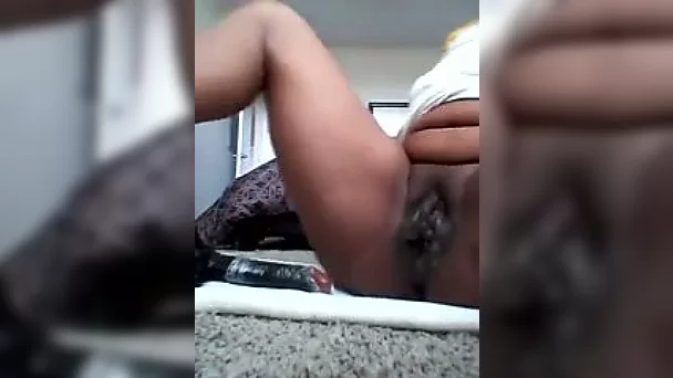 Masturbating with a vibrator on webcam and reaching orgasm
