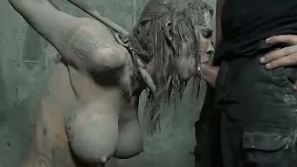 Dirty blondie with huge fake tits bounded with her hands up pleases her master