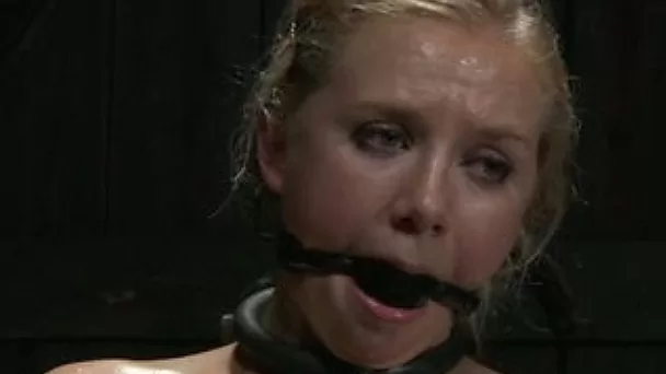 Blonde girl with a ball gag in mouth spanked and toyed