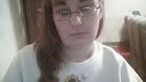 Nerdy redhead BBW webcam chick shows off her huge tits