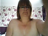 This four eyed granny is rubbing her fat pussy like crazy