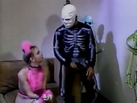 Cute white girl fucked by a helloween skeleton on the couch