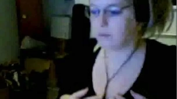 Slutty webcam blonde wearing glasses plays with her flabby tits