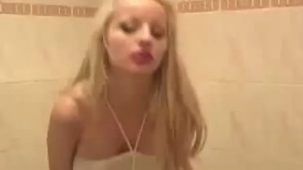 Well shaped amateur blondie Sheril flashes her curves and pisses