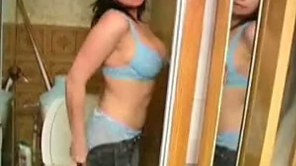 Well packed brunette called Vika pees right in the toilet room