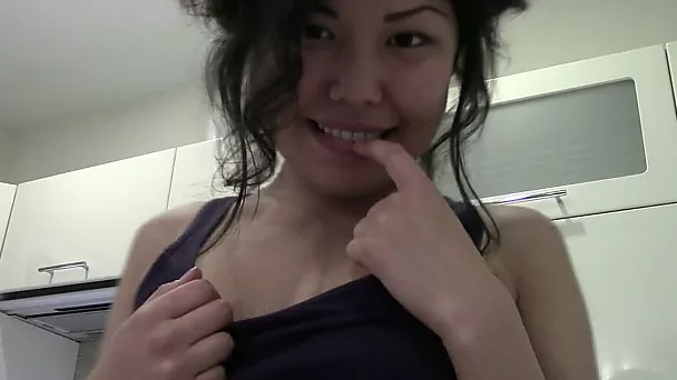 Slim natural amateur Chinese GF poses topless in the kitchen
