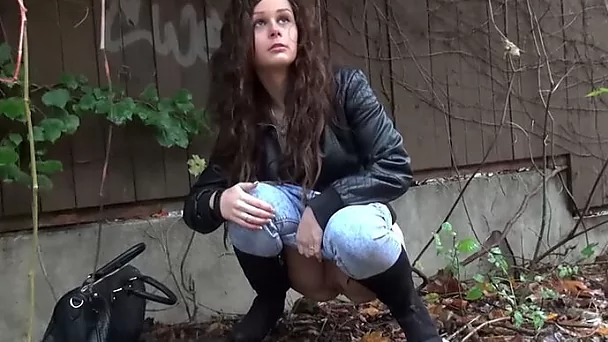 Nice outdoor solo with a lovely long-haired girl peeing