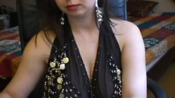 Cute brunette sweetheart sensuously sucks a dildo on livecame show