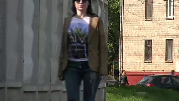Brunette white girl in tight jeans pisses in public place