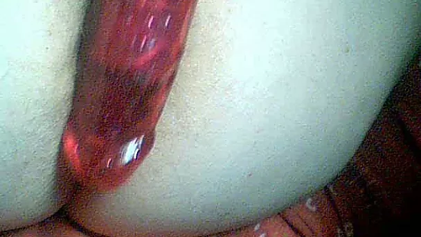 Teasing myself in the anus with my big glass dildo