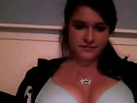 Appealing camgirl shows her tits and then rubs her pretty pussy