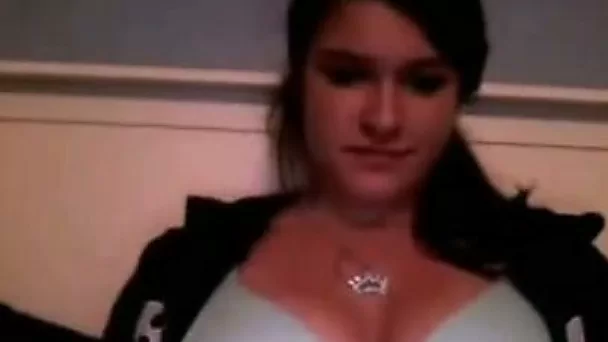 Appealing camgirl shows her tits and then rubs her pretty pussy