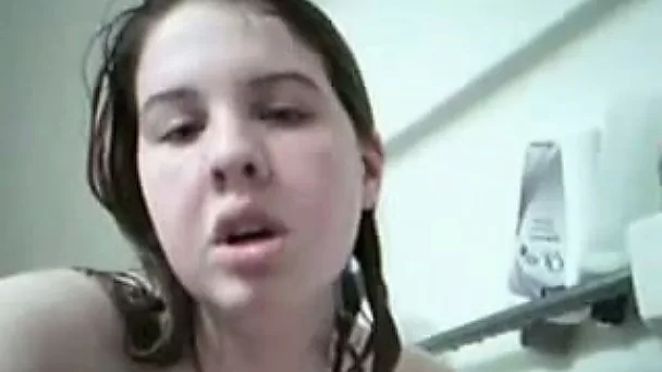 Chubby teen with well-matured breasts is masturbating in a bathtub