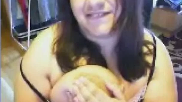 Ugly as fuck webcam bitch plays with her really huge boobies