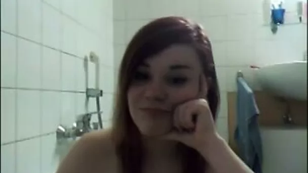 Webcam scene with gal teasing with her tits in the bathroom