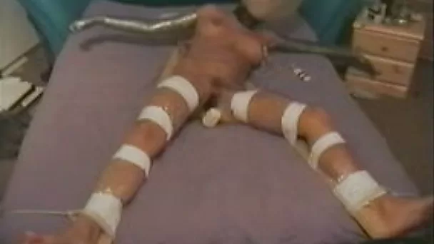 Woman in bondage gets multiple orgasms in pussy-toying clip