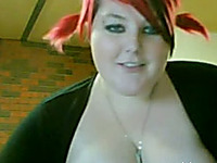 Lewd BBW with dyed hair shows her tits and meaty cunt on camera