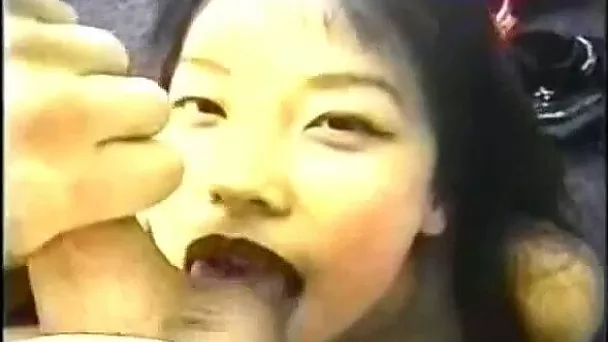 Dark haired Asian chick with slim body gives nice amateur blowjob