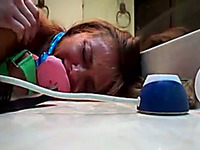 Gagged amateur chick enjoys rear banging in the bathroom