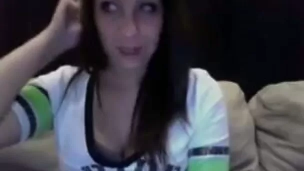 Webcam video with amateur brunette flashing her boobs