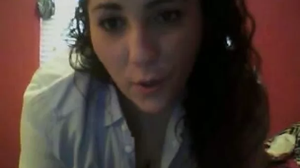 Chubby brunette chick takes off her shirt and flashes tits