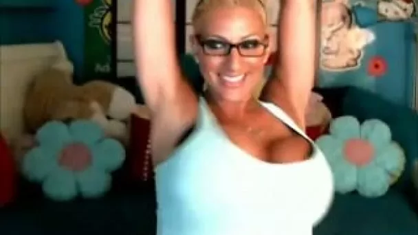 Magnificent and sophisticated blonde bimbo flashes her enormous tits