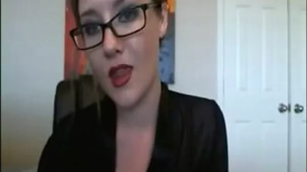 Zesty white girl in sexy glasses and red lingerie undresses on webcam