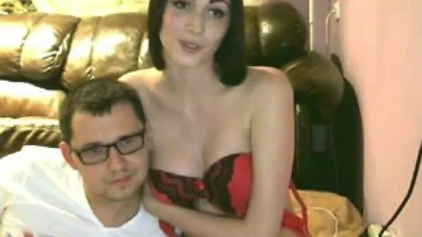 Lucky and nerdy guy showing off his mesmerizing girlfriend