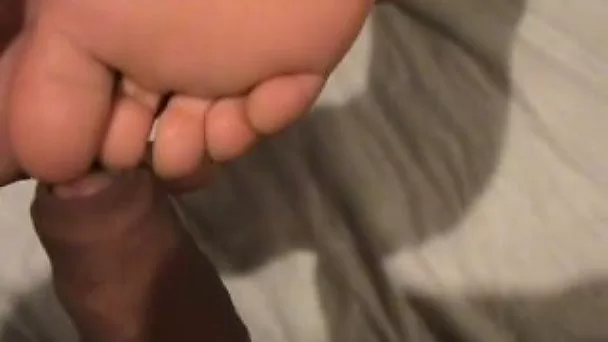 I love the way she tickles my dick with her sexy feet