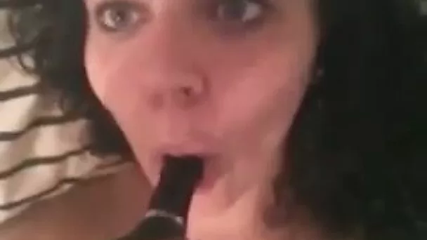 She fucks her pink pussy with toy in closeup scene