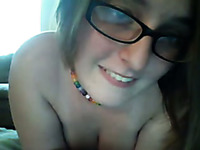 Yummy boobies of one webcam nerdy chick in glasses