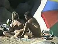 One horny mature couple having sexy time on the beach - spy vid