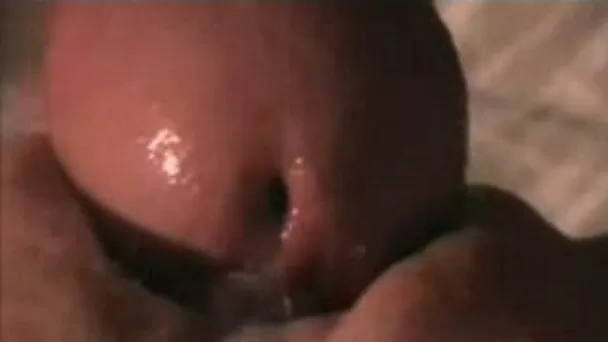 The tip of my dick very closeup about to penetrate my wife