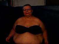 Fat and slutty blonde granny on webcam showing her huge tits