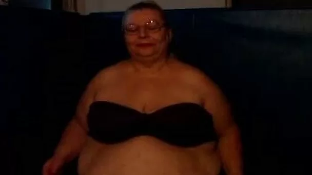 Fat and slutty blonde granny on webcam showing her huge tits